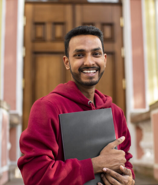 front-view-smiley-man-holding-book