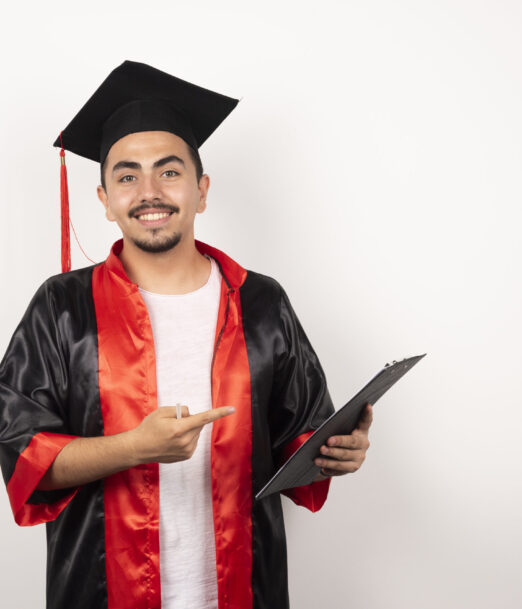 Happy graduate student pointing at his diploma on white background. High quality photo