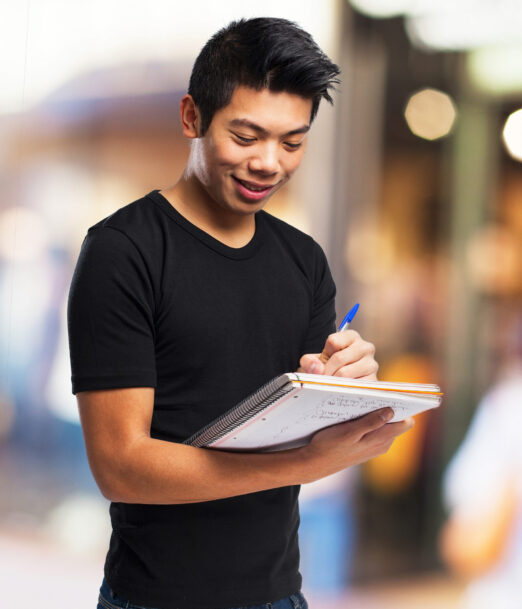 chinese man with a notebook